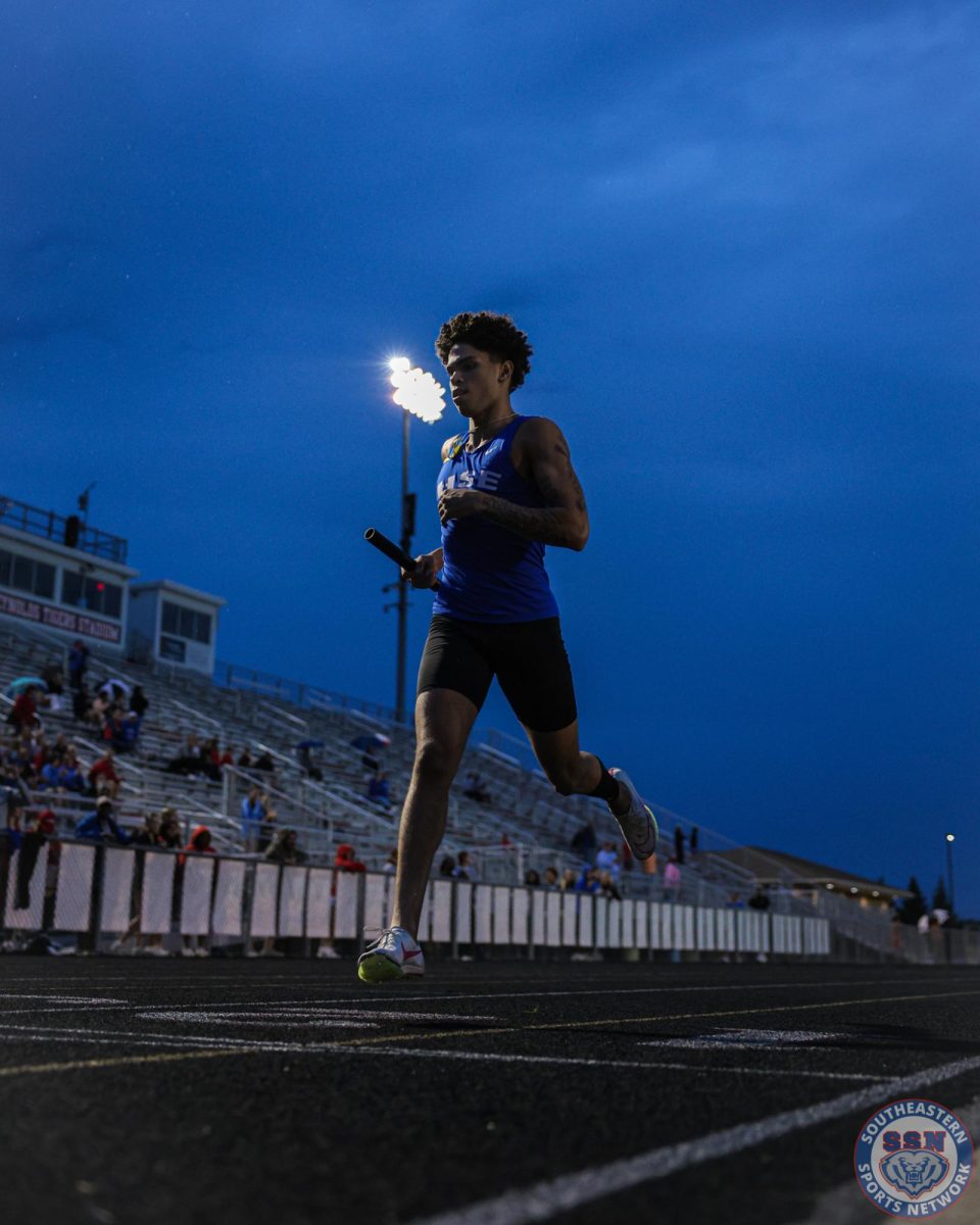 Christian Ortiz strongly finishes the 4x4 relay at Hamilton Southeastern High School on May 15, 2025.
