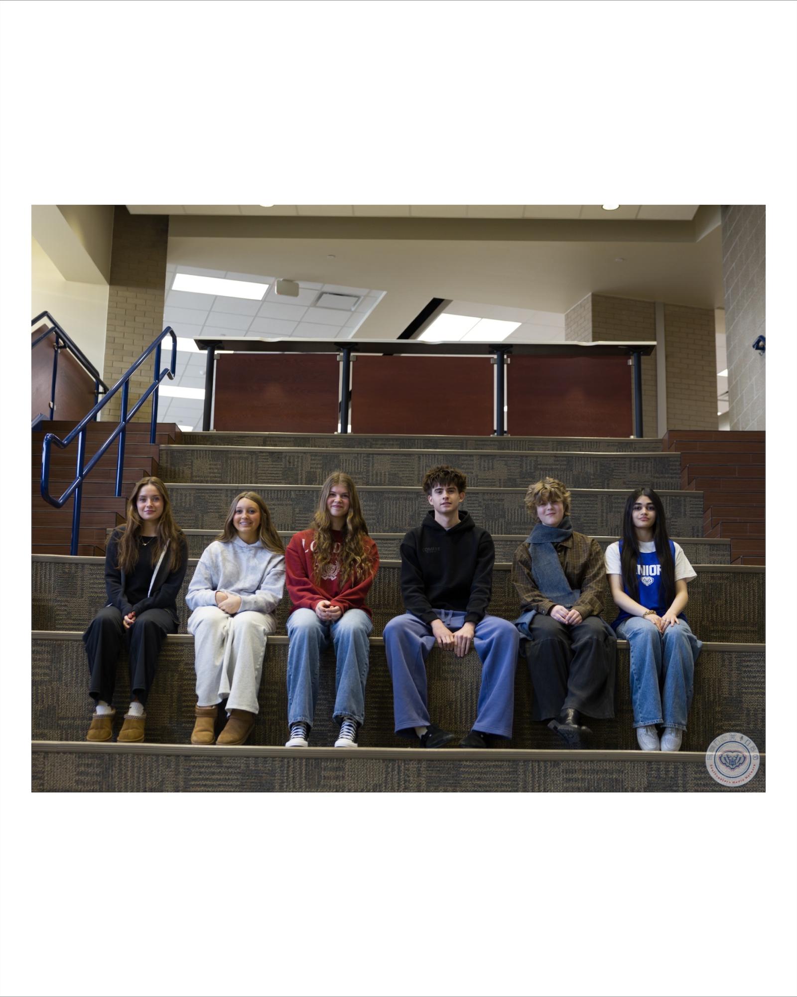 Students of the Month gather to take a group photo.