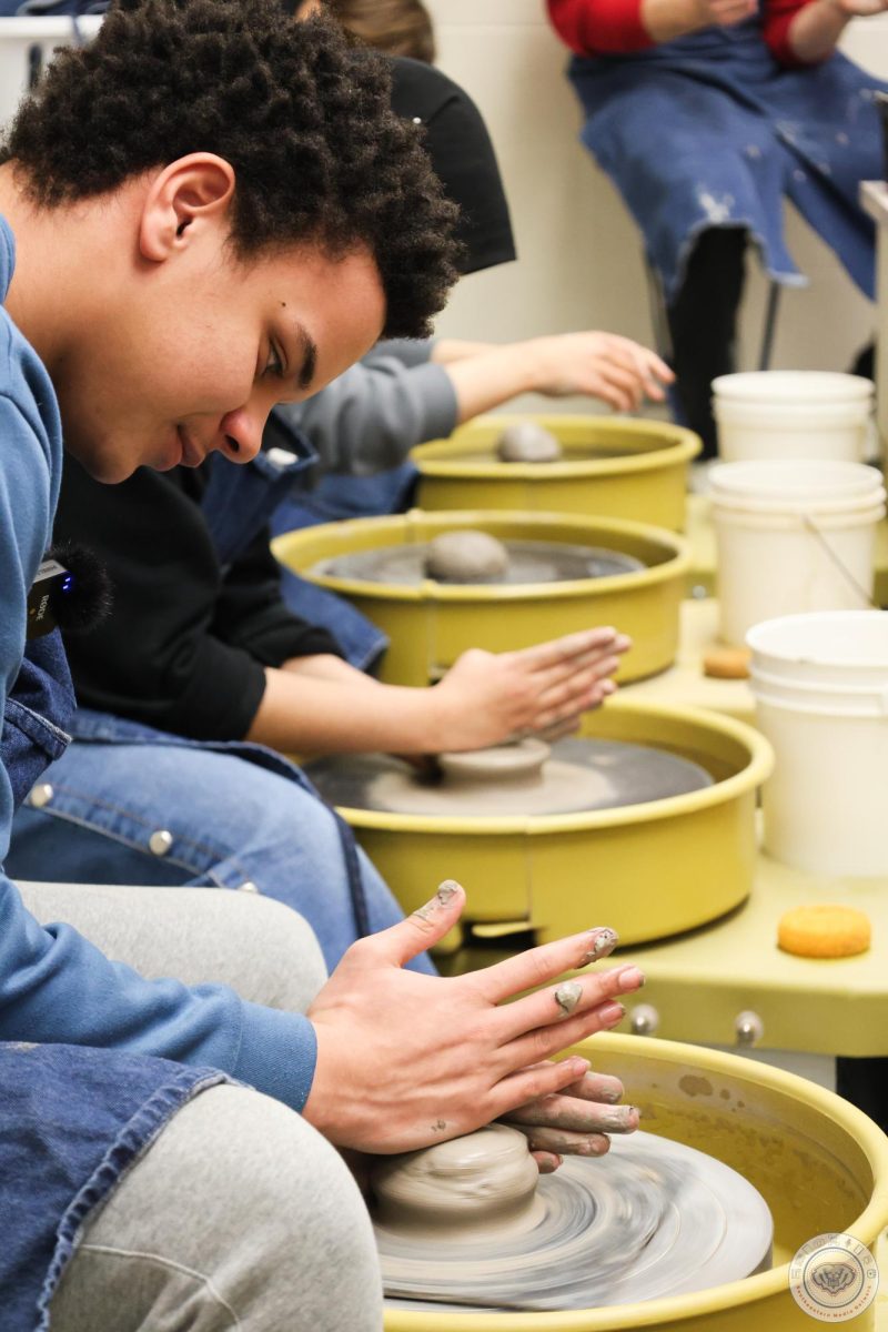 Student in ceramics, another visual arts class option.
